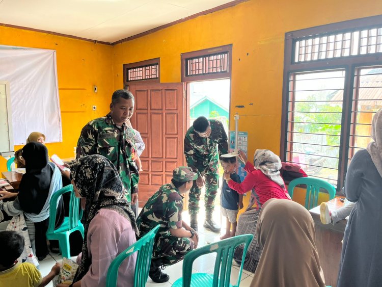 Anggota Koramil 17 Wanayasa ikut dampingi giat kader Posyandu